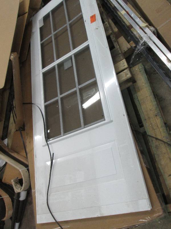 lot 19 image: 32x80 White Storm Door out of box...
