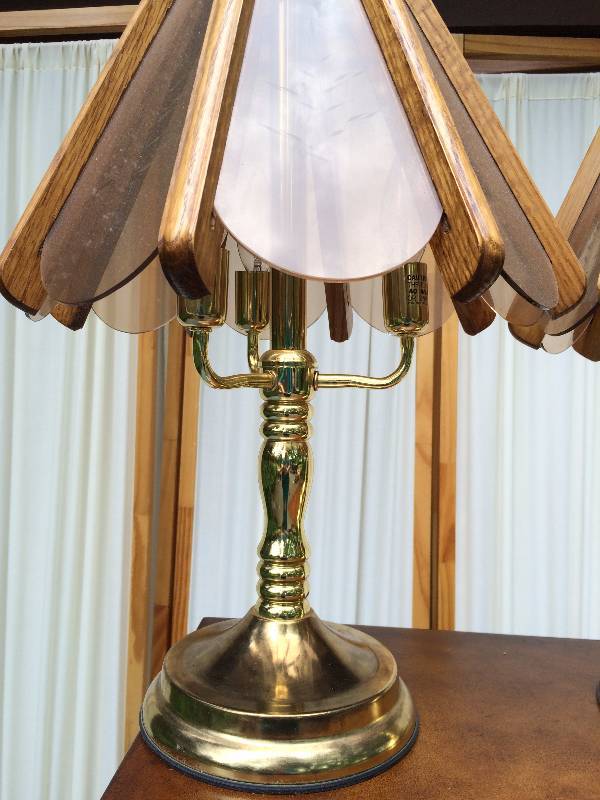 lot 55 image: Collectible Pair Mid Century 1970s Wood & Etched Smoke Glass Brass 3-Light Table Lamps - One Lamp Has Two Missing Glass Panel Which Could Be Turned To The Back