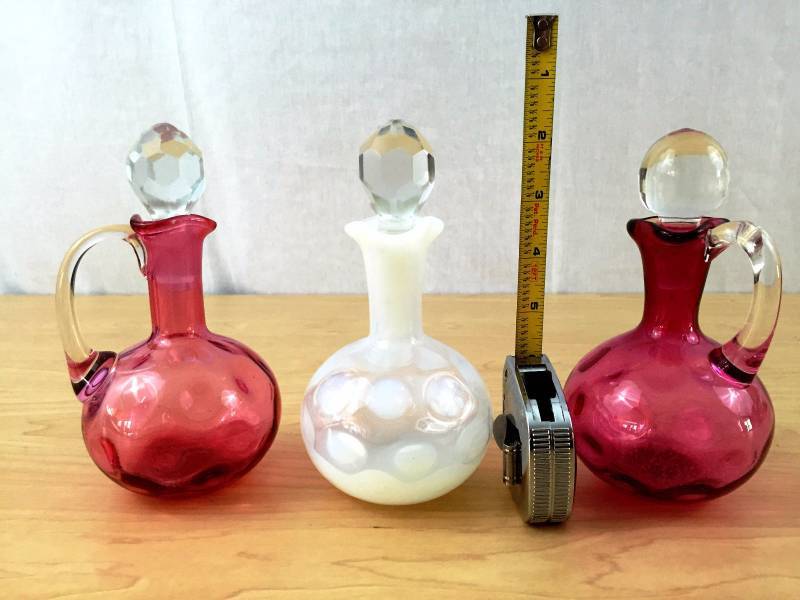 lot 46 image: VINTAGE COLLECTIBLE 3 LOVELY FENTON CRANBERRY & OPALESCENT COIN DOT SPOT THUMBPRINT HOBNAIL CRUETS WITH CLEAR FACETED CUT GLASS ORIGINAL STOPPERS - EXCELLENT CONDITION