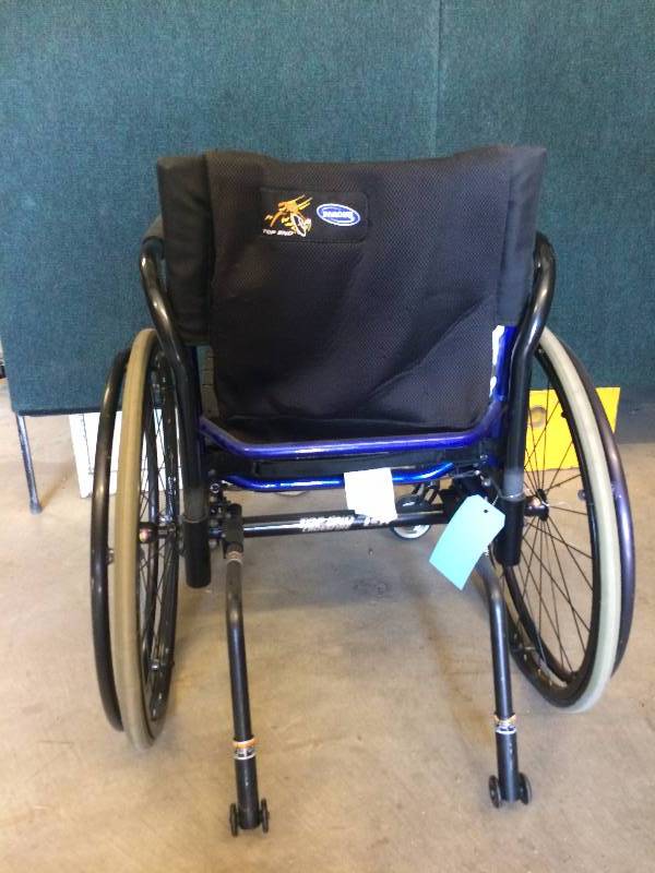 lot 63 image: Invacare Hotwheels Metallic Blue TGA Top End Crossfire Wheelchair features a minimalist, open frame design to make vehicle transfers easier - Excellent Condition