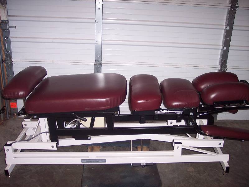 lot 3 image: Chiropractic Table for Patient Adjustments at Medical Clinic Chiropractor Clinic Medical Center - Raise Lower Height Tilt - Works Great - Couple Scrapes In Upholstery Power Cord Wrapped with duck tape - See Pics