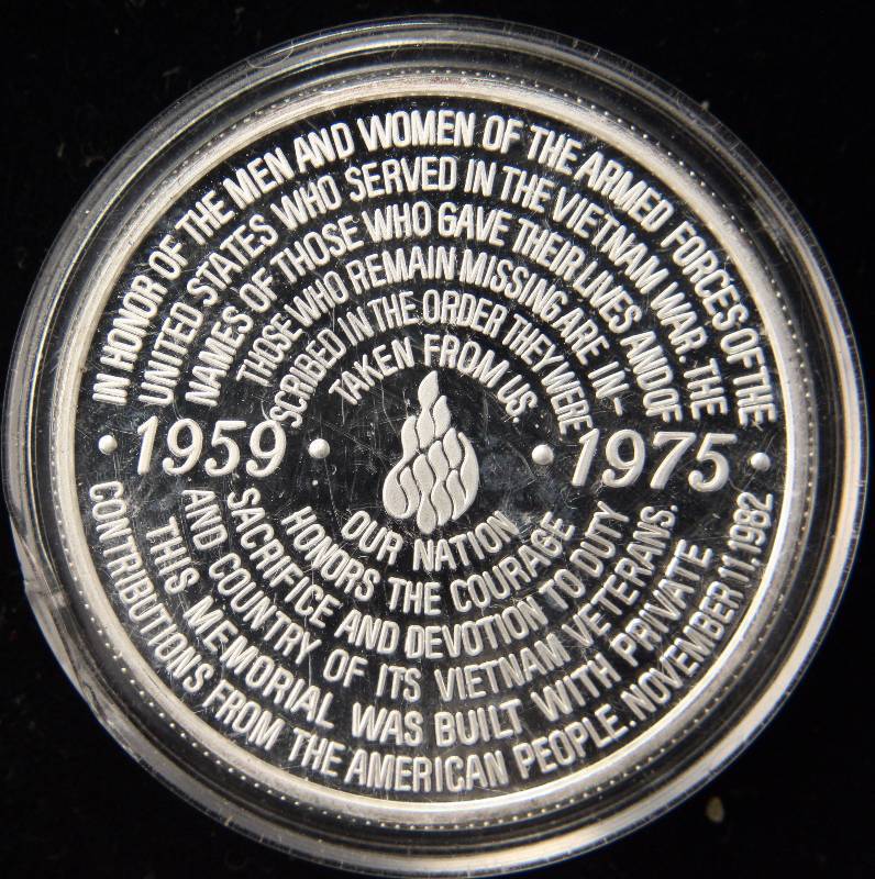 lot 16 image: 1 TROY OZ. .999 FINE SILVER VIETNAM VETERANS MEMORIAL ROUND IN AIRTITE HOLDER