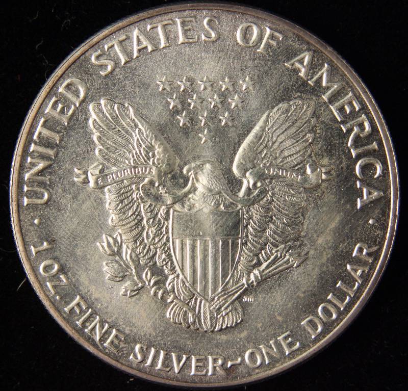 lot 24 image: 1987 AMERICAN SILVER EAGLE 1 TROY OZ. .999 FINE SILVER DOLLAR