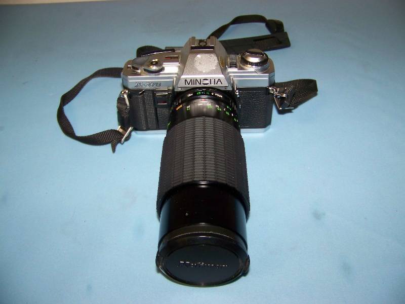 lot 77 image: Minolta, X-370, 35mm SLR Camera with Vivitar, Flash Accessory, Extra Long Range Lens and Travel Bag