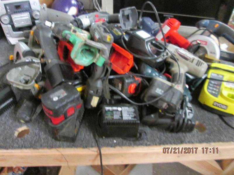 lot 233 image: lot of cordless drills and chargers...