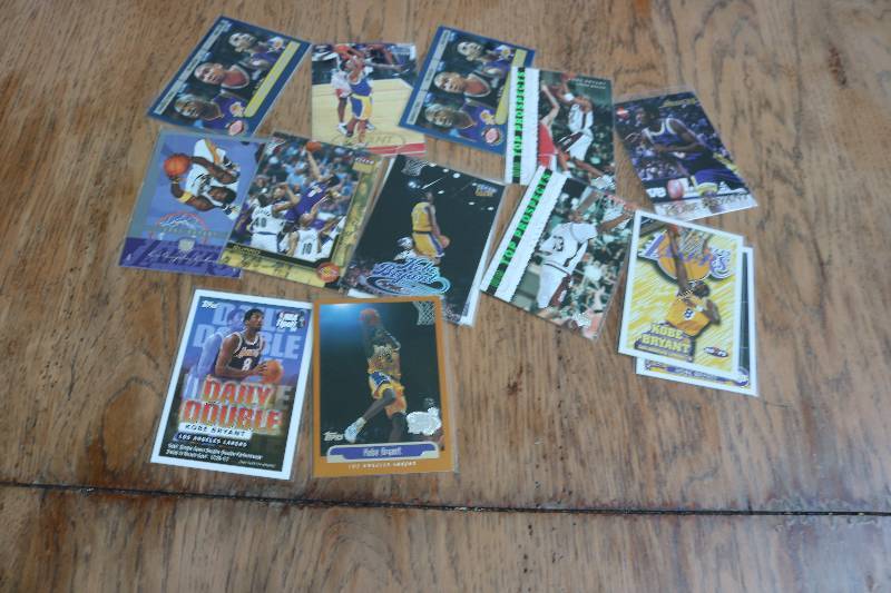 lot 110 image: 15 Kobe Bryant cards...