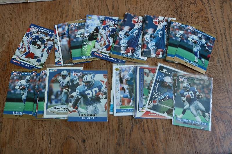 lot 119 image: 50 Barry Sanders cards...