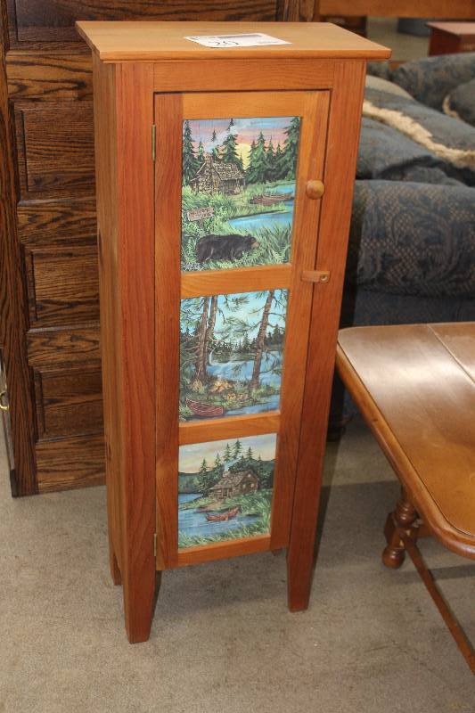 lot 20 image: Outdoor Woods Scene Dcor 1-Door 4-Shelf Wood Cabinet