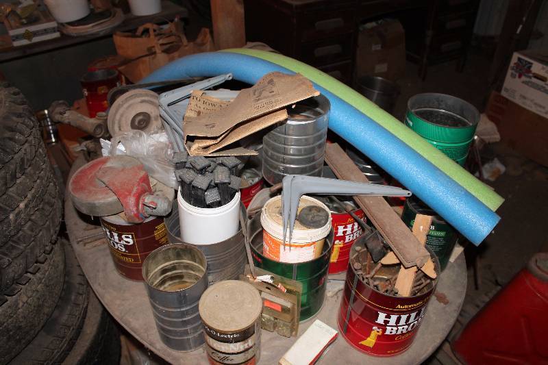lot 226 image: Table w Contents Includes Shelf Brackets, Pool Noodles, And More