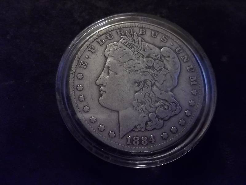 1884 CC  Morgan Silver Dollar ( High Value- Fine $125.00 Wholesale Grey Sheets)