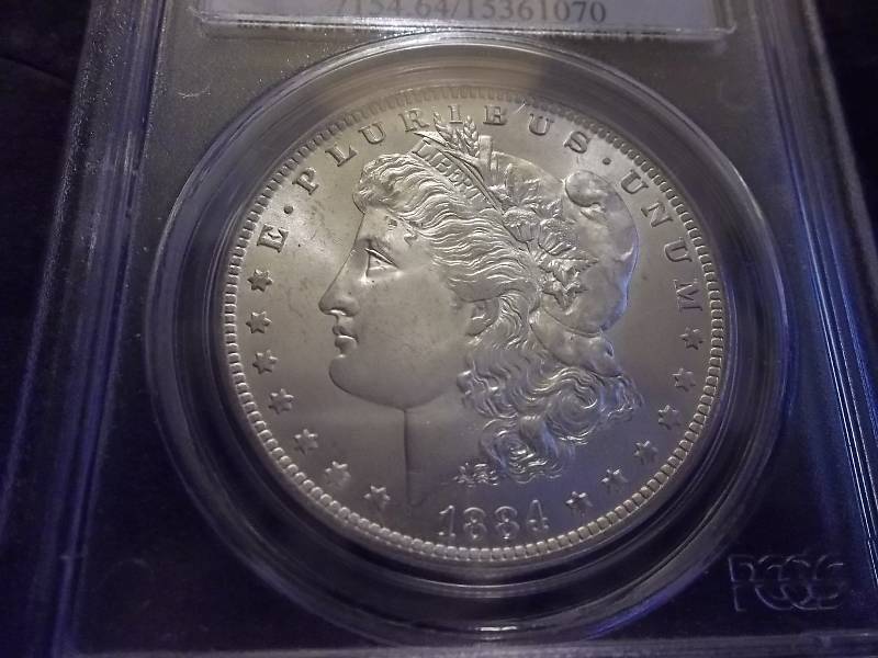 1884 O Morgan Silver Dollar Higher Grade MS64 PCGS Graded In Holder (Valued  $100.00)