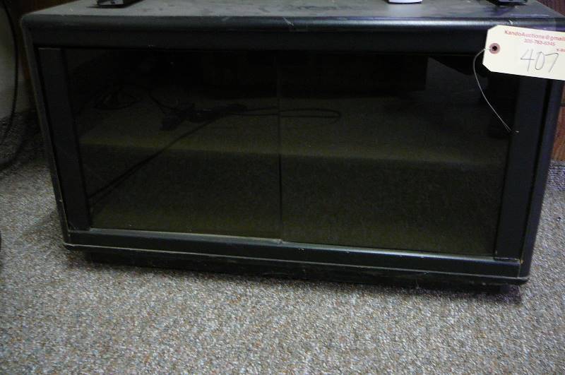 lot 407 image: TV Stand with glass door