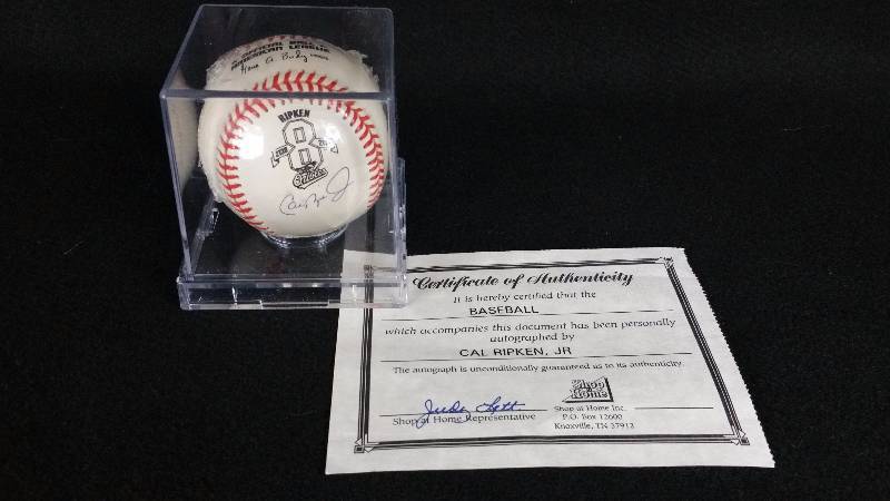 lot 17 image: Cal Ripken Jr Autographed Orange Stitched Commerorative Baseball