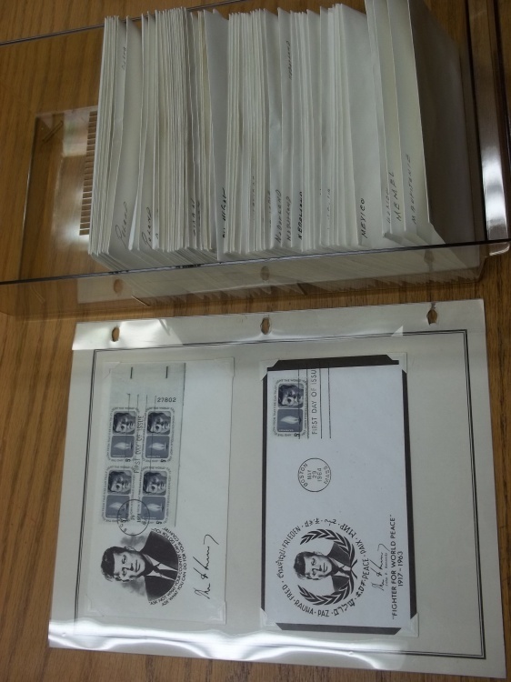 lot 16 image: First Day Issue Stamps with Large Shoe box tote of Assorted Stamps