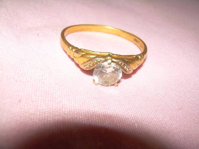 BAND SAYS 14 KT WITH DIAMOND STONE