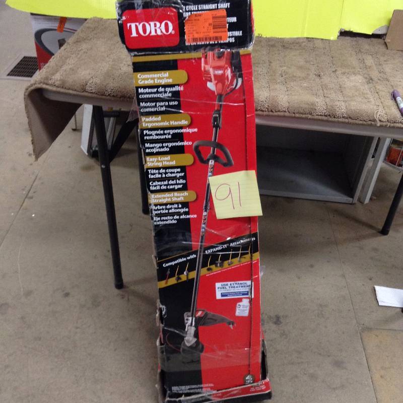 lot 91 image: Toro 2 Cycle Straight Shaft Trimmer