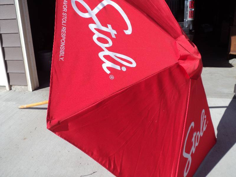 lot 18 image: stoli red umbrella 80in diameter, 7...