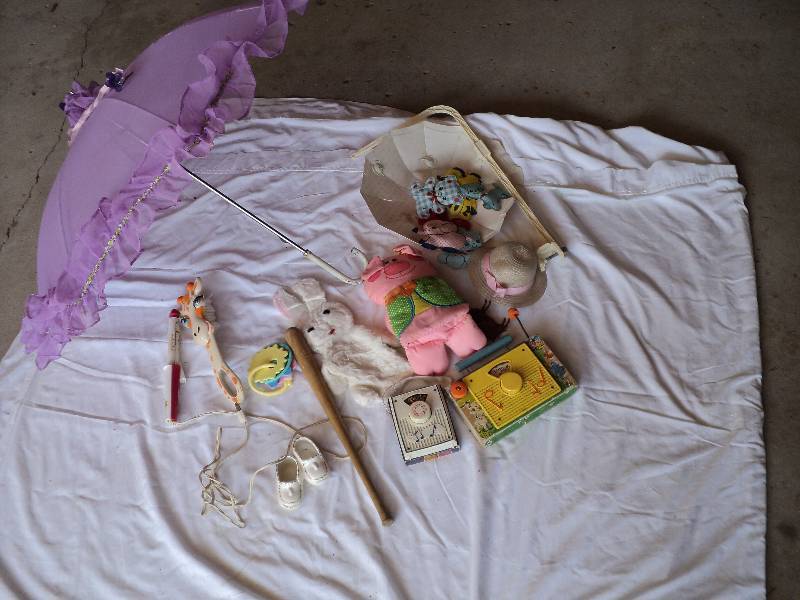 lot 29 image: vintage toys and parasol...