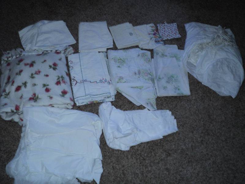 lot 39 image: tote of blankets, sheets, and pillo...