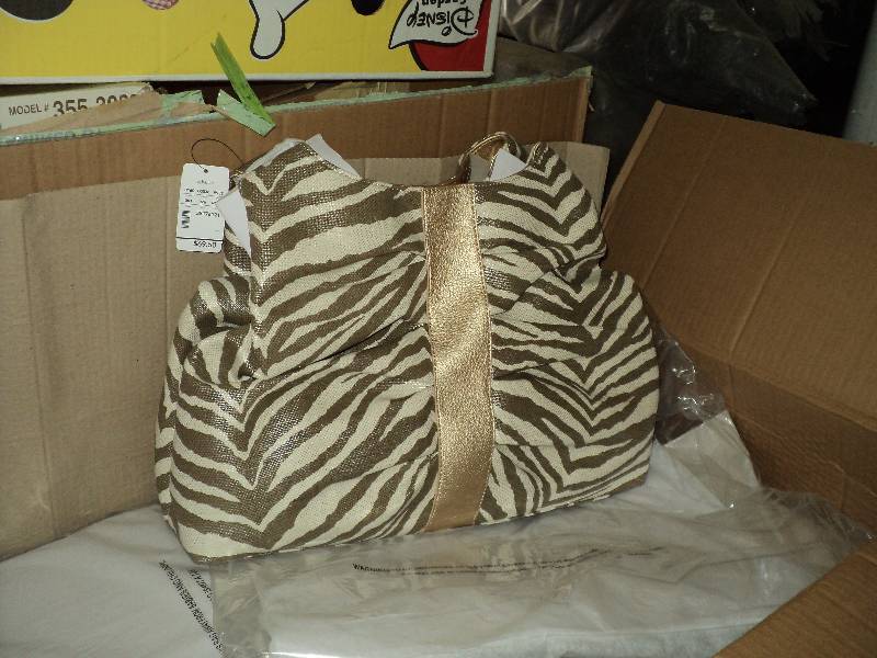 lot 81 image: box of 12 new CJ Banks purses, each...