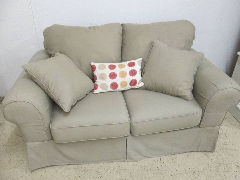 lot 142 image: Tan Fabric Loveseat with Pillows...