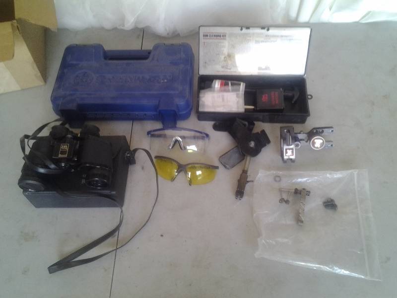 lot 55 image: Gun Cleaning Kit, Smith & Wesson Pistol Case, Safety Glasses, Binoculars, Bow Site, Arrow Rest & Release