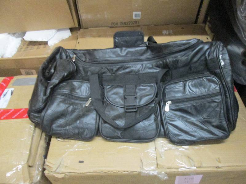 lot 13 image: Black Rolling Duffle Bag- paint spo...