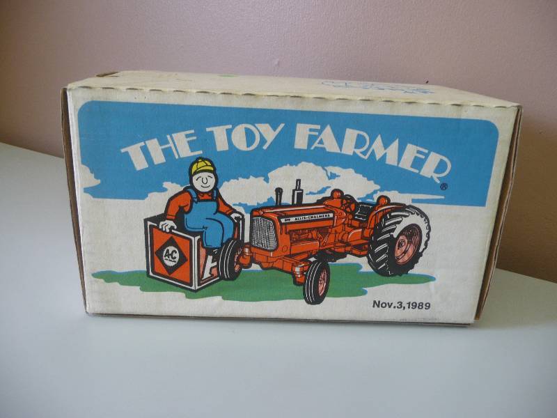 lot 43 image: Ertl Inc. Allis-Chalmers D19 Tractor - The Toy Farmer Nov. 3, 1989 - Mint, New In Box - See Pictures