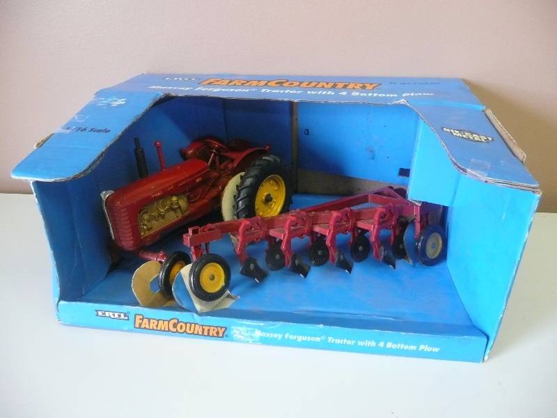 lot 45 image: Ertl Inc. 116 Scale Farm Country Massey Ferguson Tractor With 4 Bottom Plow - Still In Box - 1995 - See Pictures