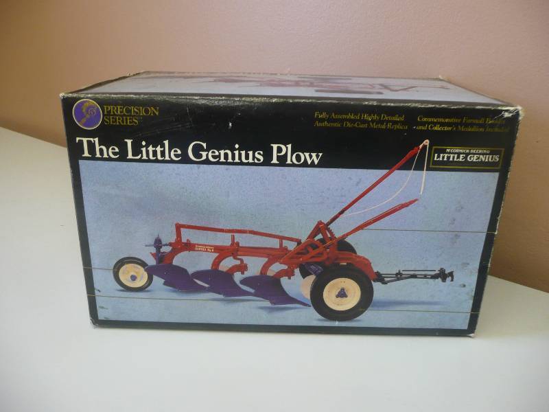lot 53 image: Ertl Inc. Precision Series McCormick-Deering The Little Genius Plow - Authentic Die-Cast Metal Replica & Collectors Medallion Includes - New In Box - See Pictures