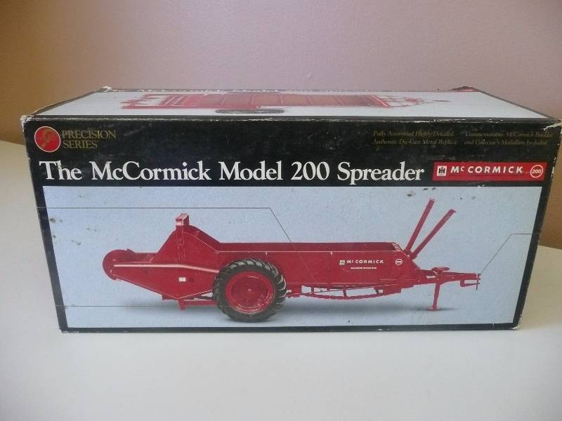 lot 70 image: Precision Series McCormick The McCormick Model 200 Spreader - Authentic Die-Cast Metal Replica - New In Box - See Pictures