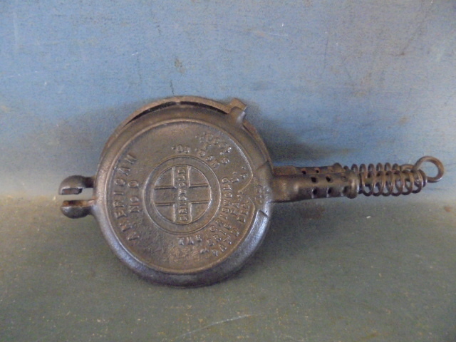 lot 15 image: Griswold Cast Iron Mini Waffle Iron