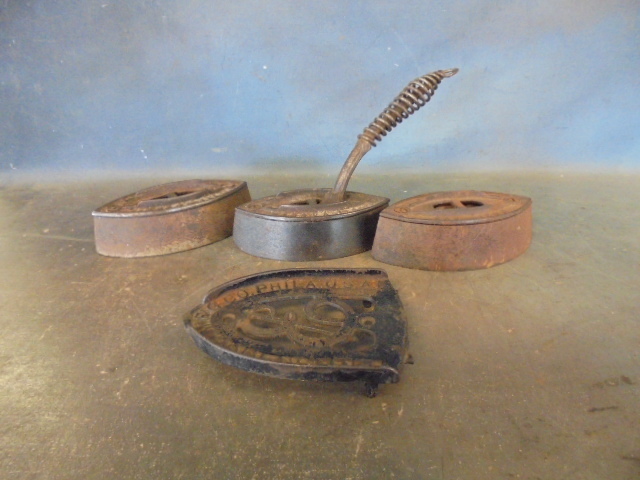 lot 94 image: Antique Clothes Irons and Trivet