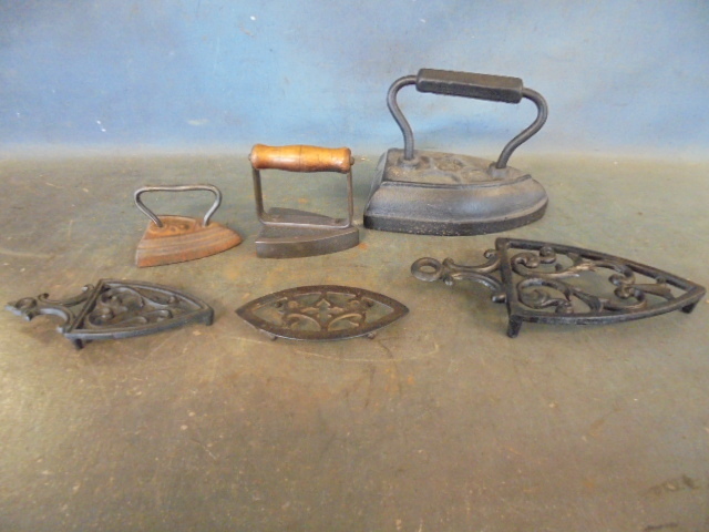 lot 95 image: Antique Clothes Irons and Trivets