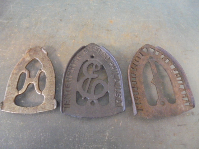 lot 99 image: Cast Iron Trivets