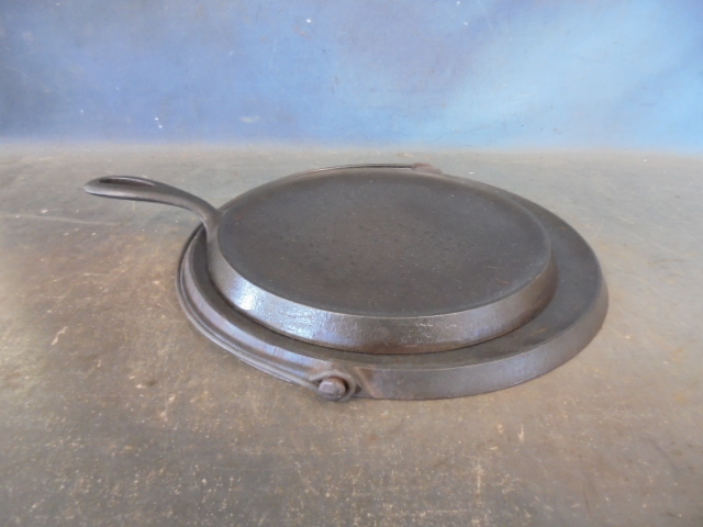 lot 100 image: Griswold Cast Iron Griddles