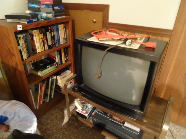 lot 129 image: Wood shelving unit. Misc VHS tapes....