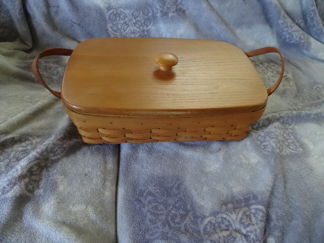 lot 221 image: Longaberger basket with wood cover....