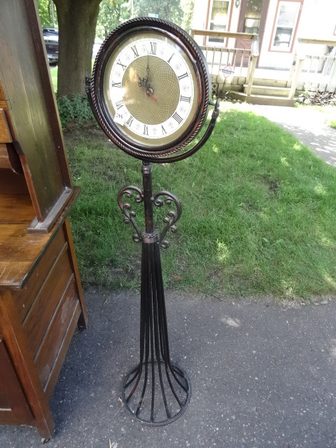 lot 253 image: Metal pedestal roman numeral clock....