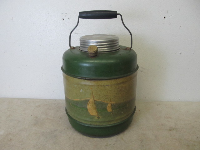 lot 12 image: Vintage Stoneware-Lined Metal Sailboat Jug