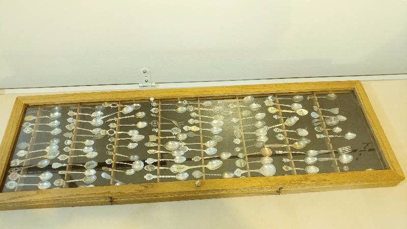92 Collectible Spoons in Glass Display