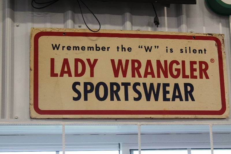 lot 45 image: Lady Wrangler Sportswear Sign