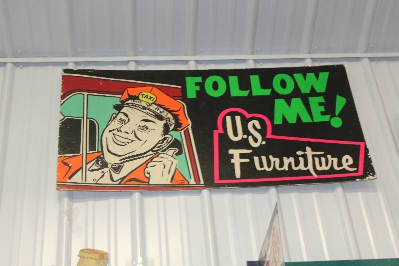 lot 52 image: U.S. Furniture Follow Me Cardboard Sign