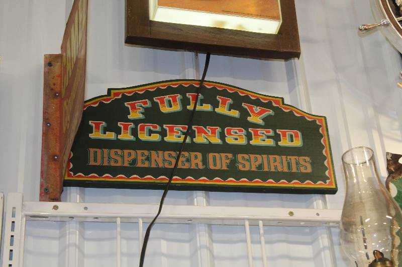 lot 60 image: Fully Licensed Dispenser Of Spirits Wood Sign