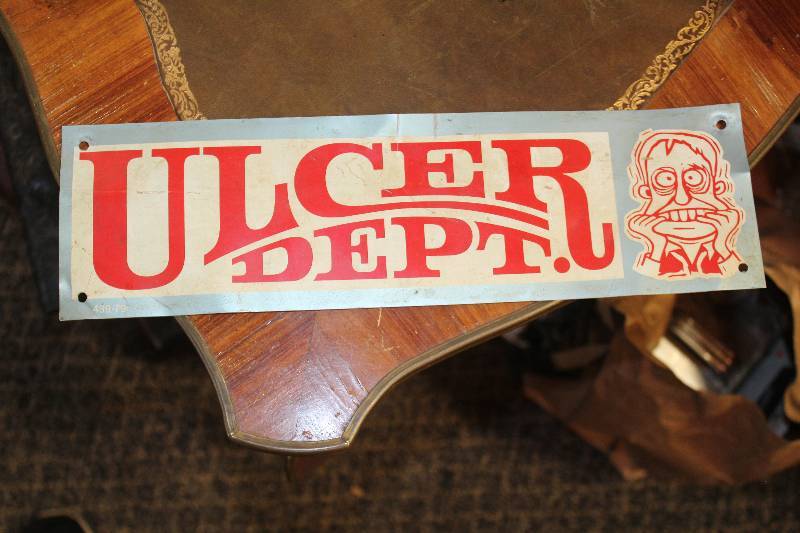 lot 136 image: Ulcer Dept. Metal Sign