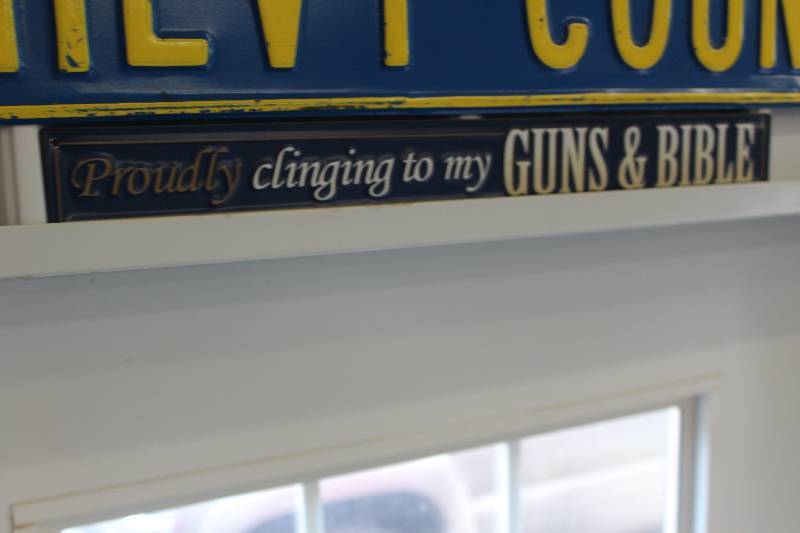lot 336 image: Proudly Clinging To My Gun And Bible Metal Sign