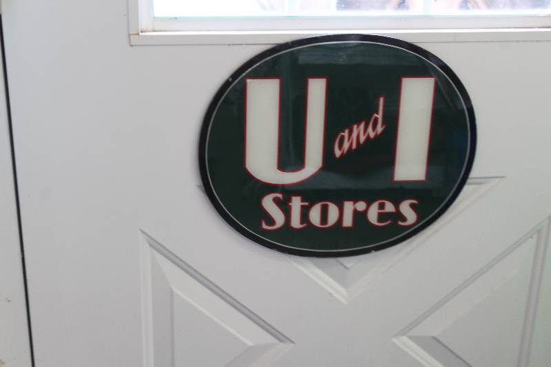 lot 338 image: U and I Stores Glass Sign
