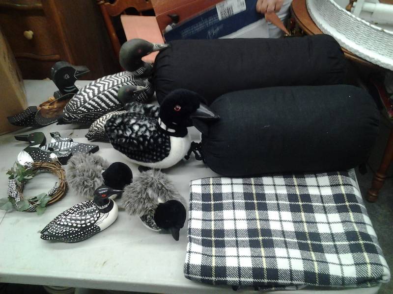 lot 43 image: Plaid Throw Blanket, Bolster Pillows, Plush Loons, Wood Loons, Misc