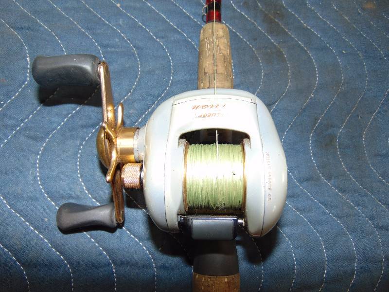 lot 69 image: Left Handed Bait Caster Reel with Rod