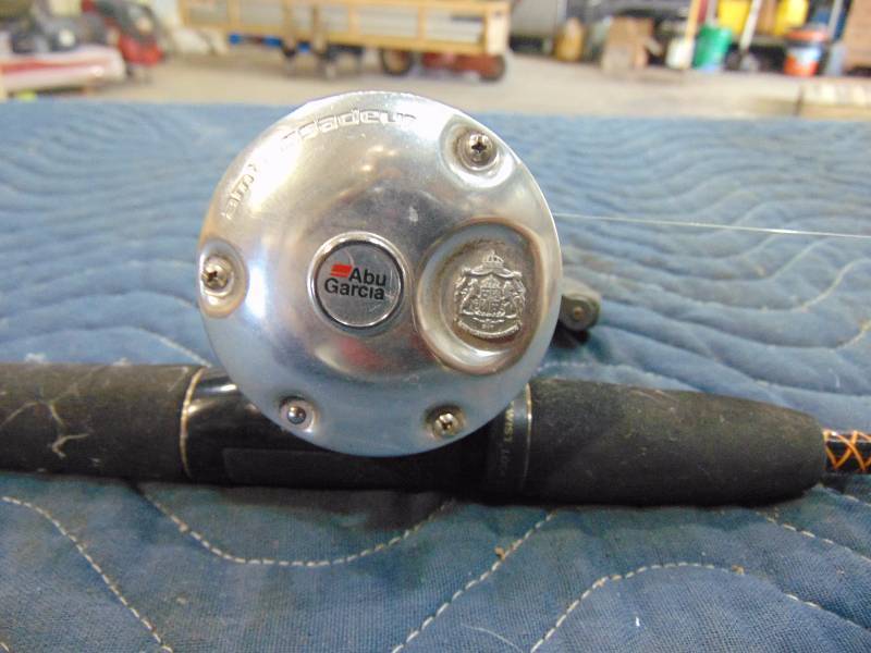 lot 70 image: Left Handed Bait Caster Abu Garcia Reel with Rod